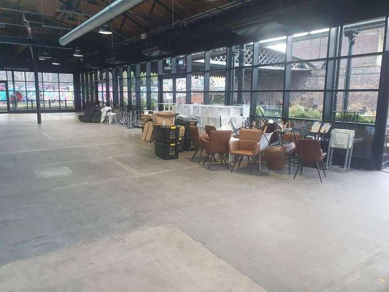 Commercial office relocation in progress — wrapped furniture ready for transit